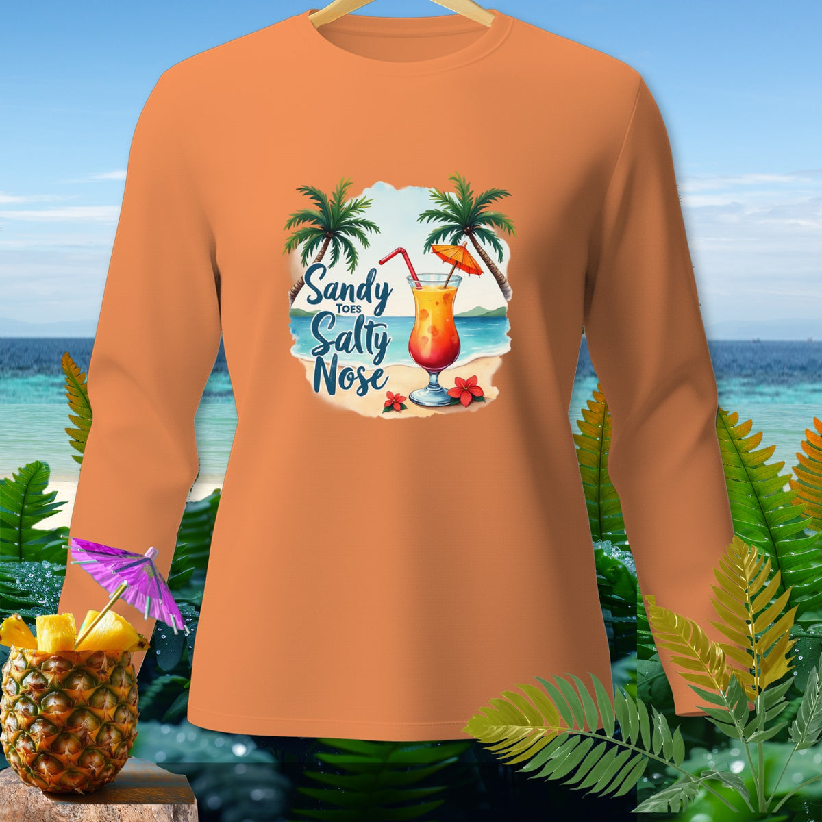 Orange long-sleeve shirt with beach graphic and "Sandy Salty Nose" text.