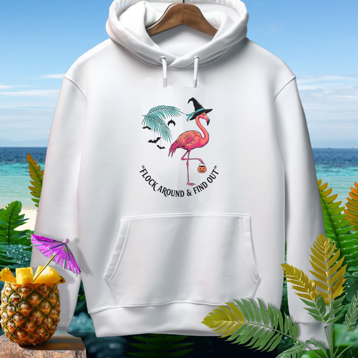 White hoodie with Halloween flamingo graphic and text "FLOCK AROUND & FIND OUT".