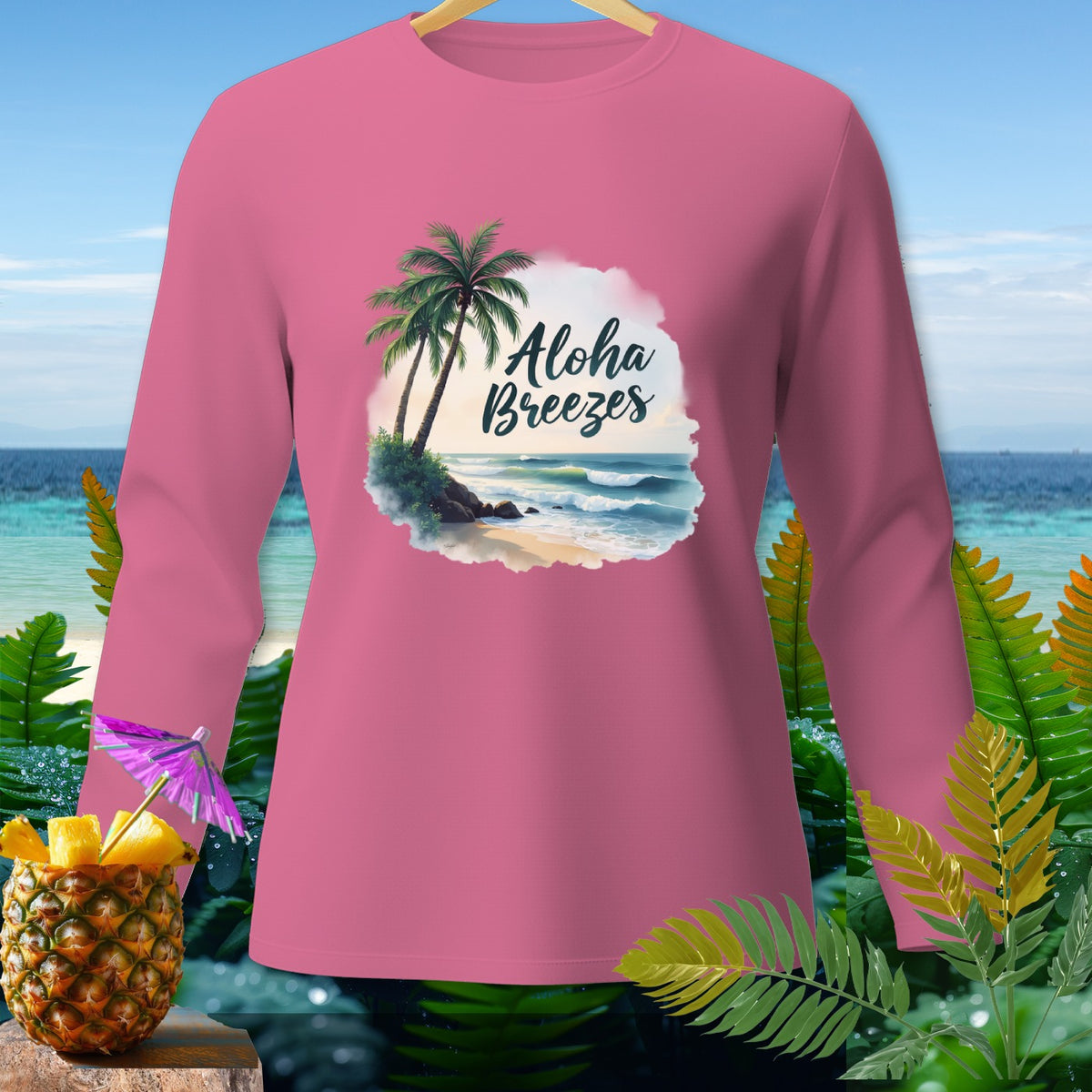 Pink long-sleeve shirt with "Aloha Breezes" beach scene graphic.