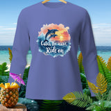 Long sleeve shirt with dolphins jumping over a sunset wave graphic and text.