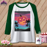 Raglan sleeve t-shirt with jack-o'-lantern on beach sunset graphic.
