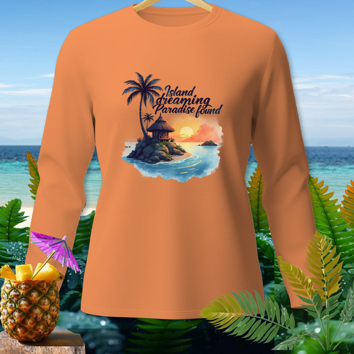 Orange long-sleeve shirt with "Island dreaming Paradise found" graphic.