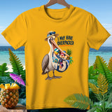 Yellow t-shirt with a pelican holding a bag full of beach items. 