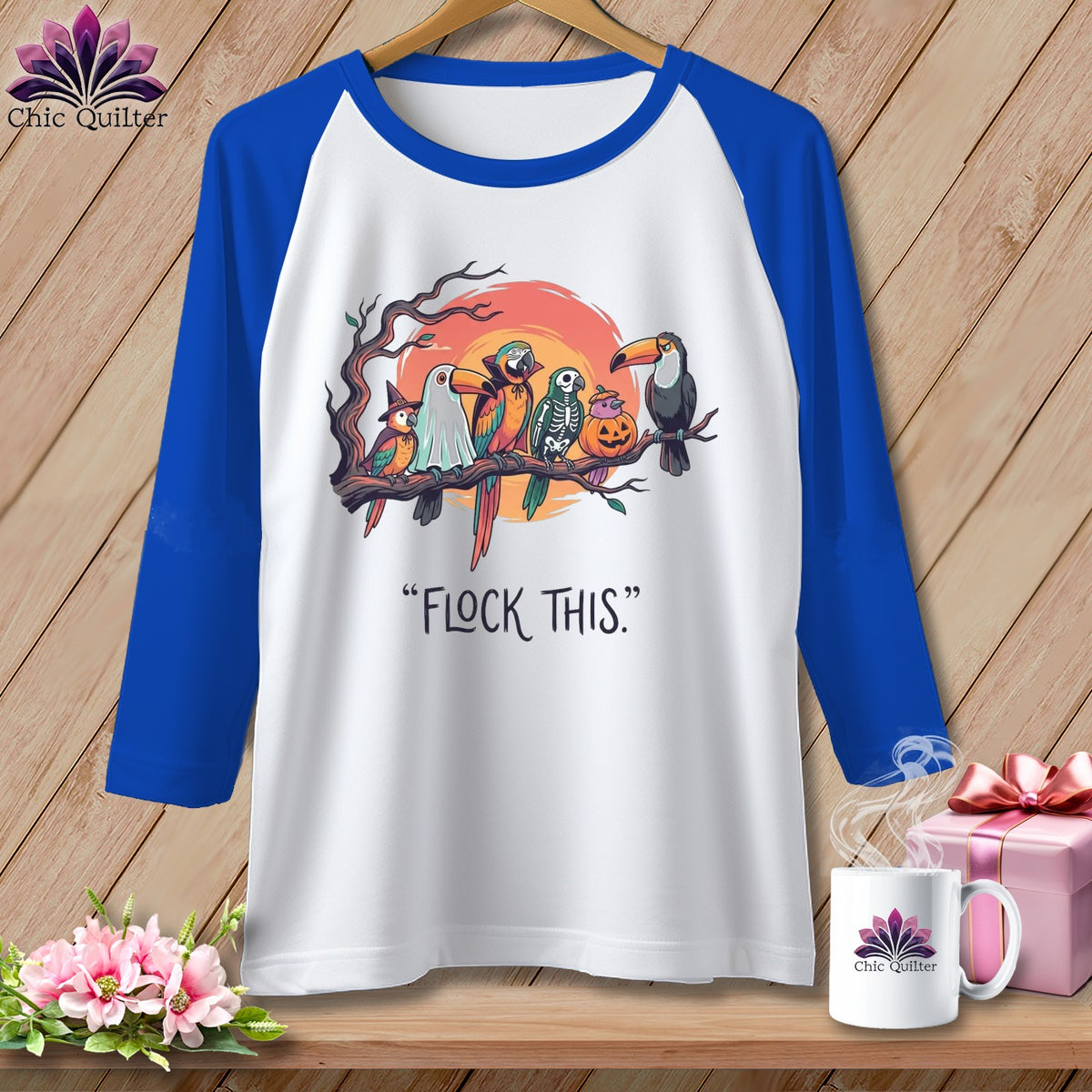 White raglan sleeve shirt with Halloween birds and "Flock This" text.