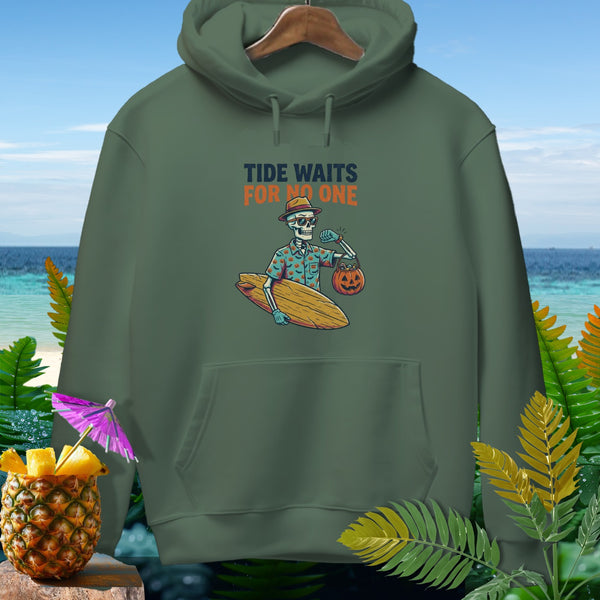 Green hoodie with graphic of skeleton holding surfboard and pumpkin, text "Tide Waits For No One".