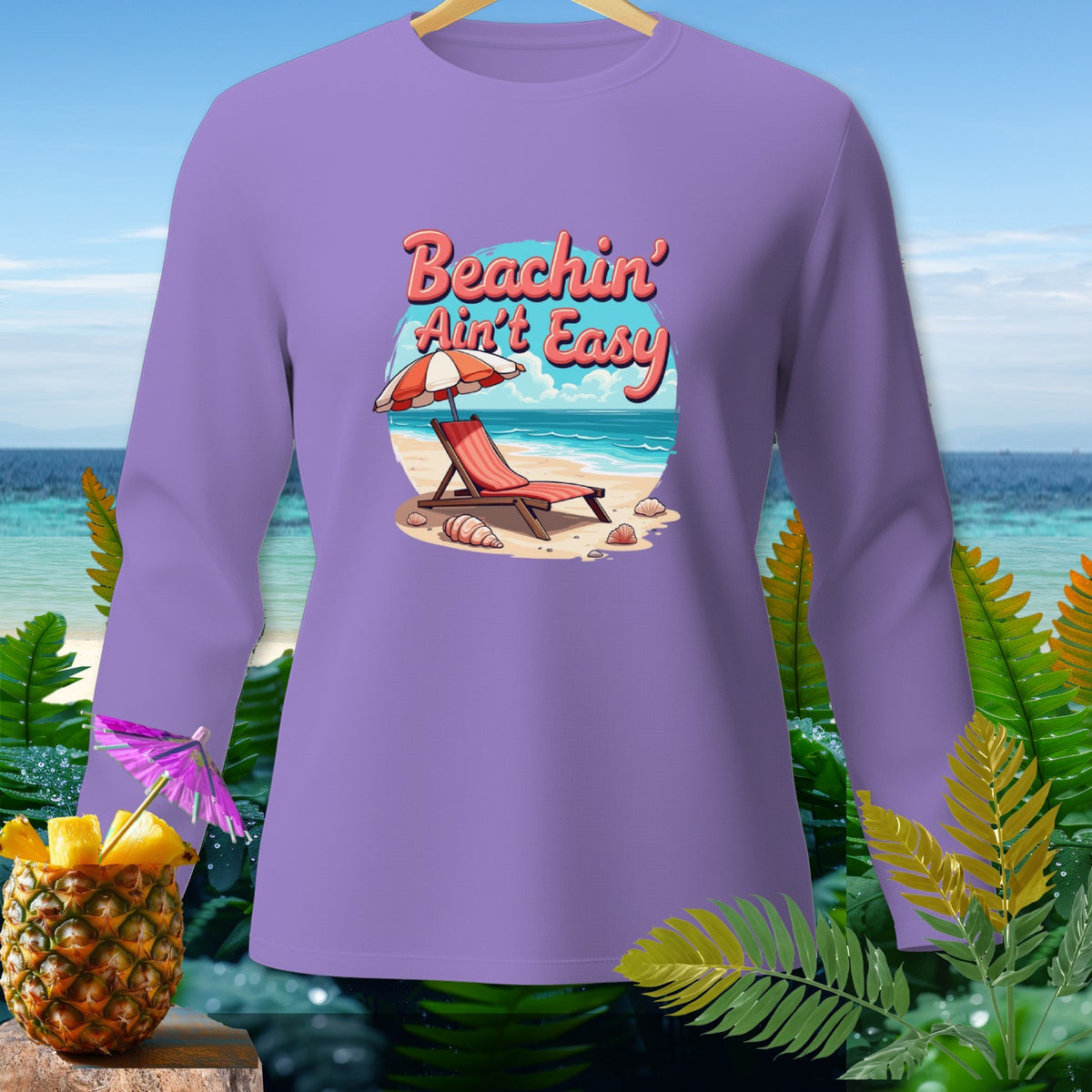 Purple long-sleeve shirt with a beach graphic and "Beachin' Ain't Easy" text.