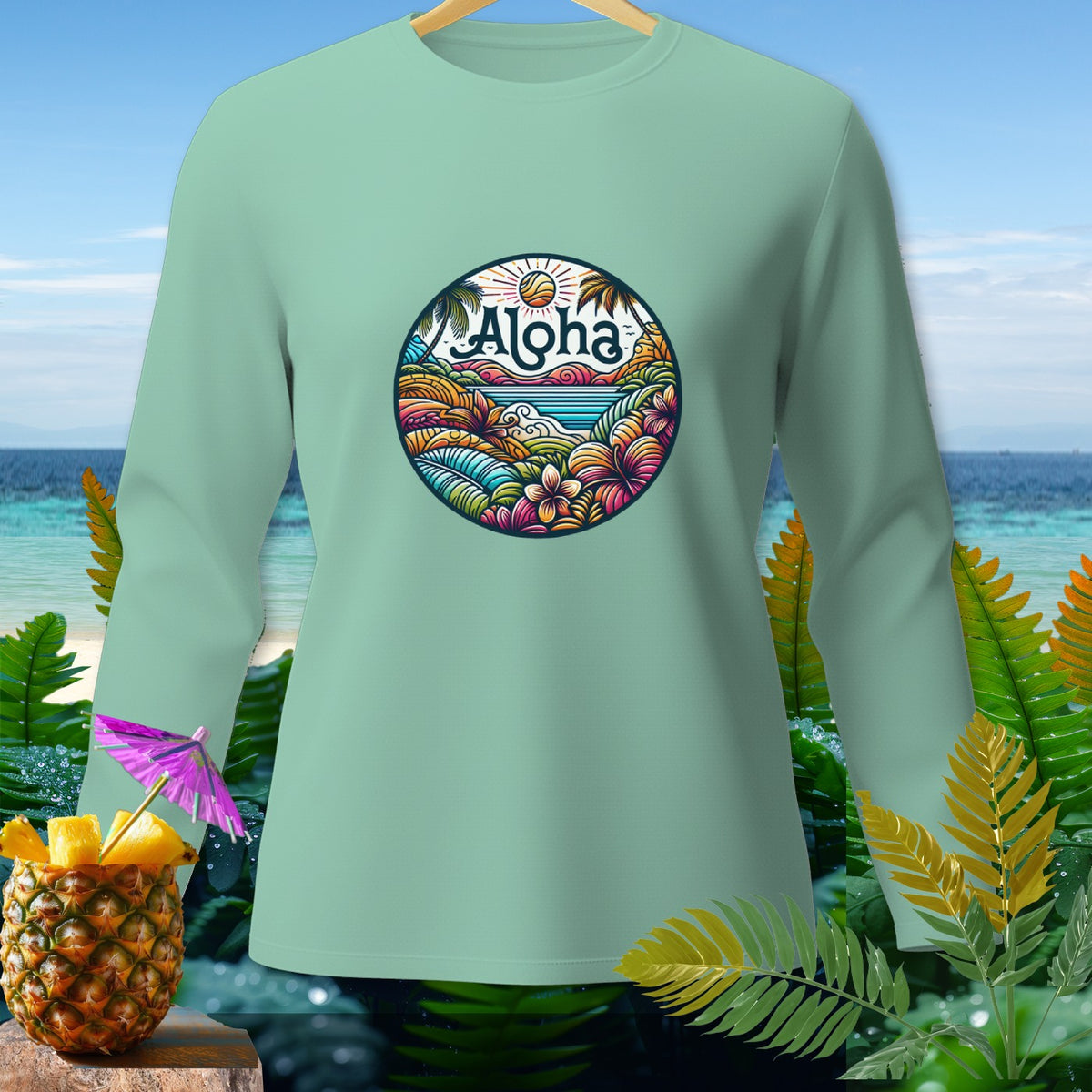 Mint long sleeve shirt with "Aloha" tropical island graphic and pineapple cocktail.