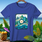 Blue t-shirt with tropical landscape design featuring mountains, waterfalls, and ocean with 
