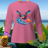 Pink long-sleeved shirt with a colorful owl graphic above a wave and sunset.