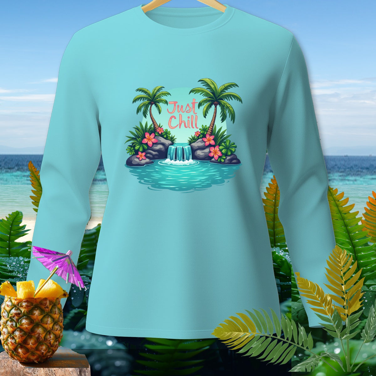 Light blue long sleeve shirt with "Just Chill" text over a tropical waterfall scene.
