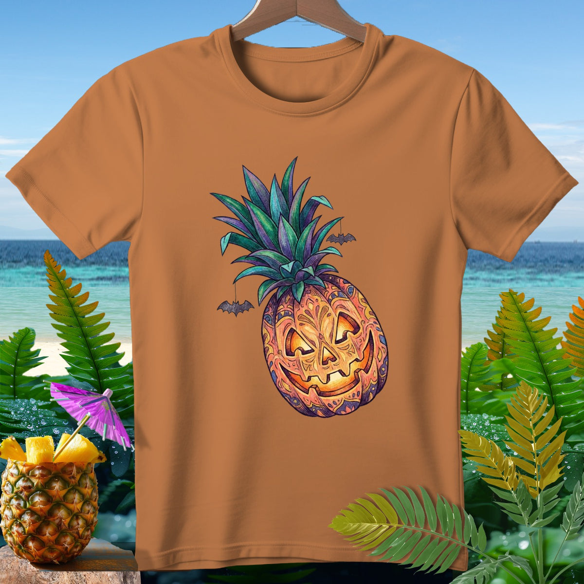 Orange t-shirt with a jack-o'-lantern pineapple graphic and hanging bats.