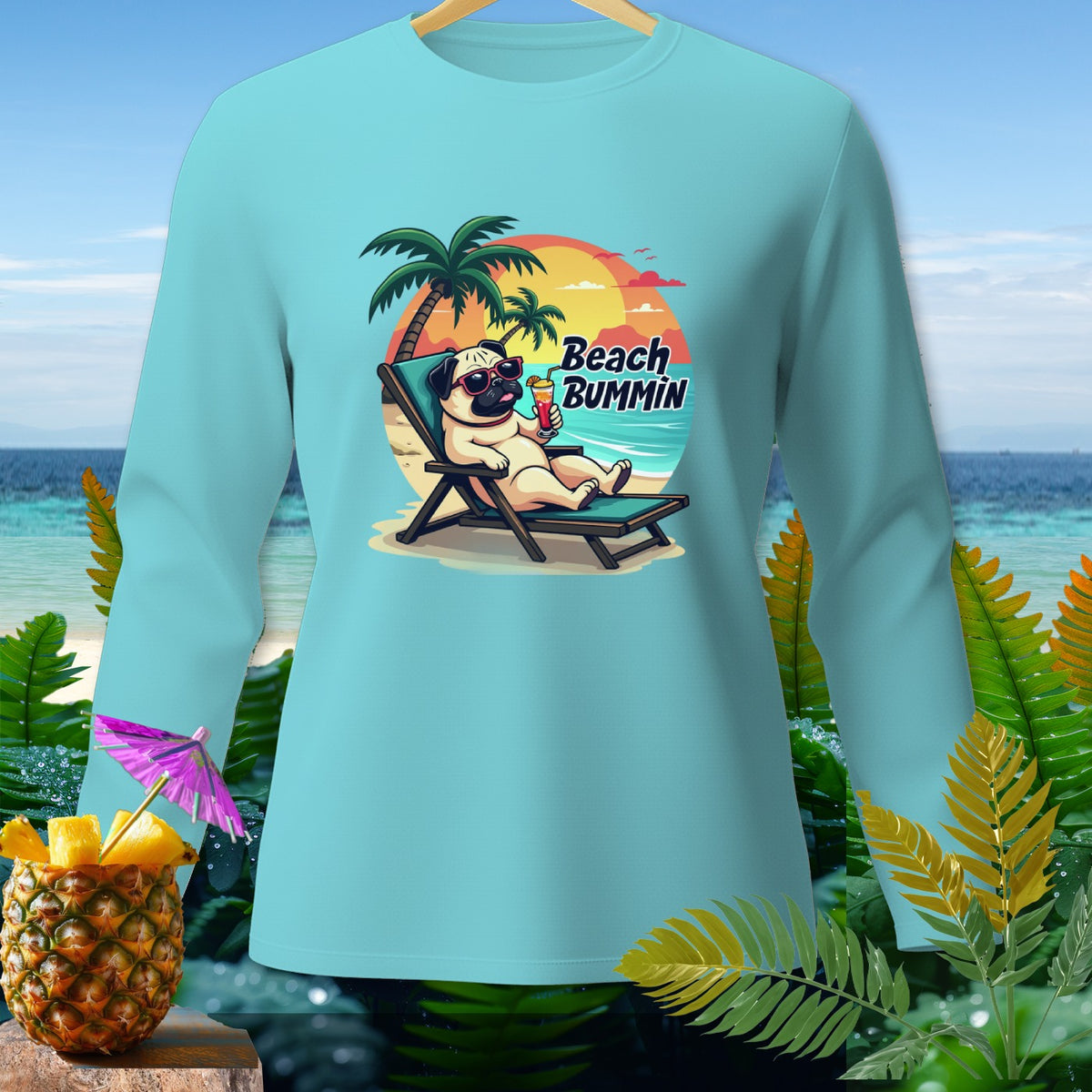 Light blue long-sleeve shirt with pug on beach chair, "Beach Bummin" text.