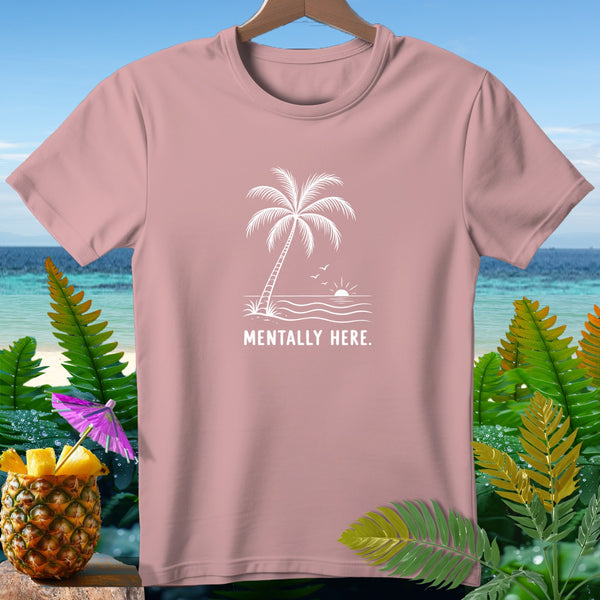 Pink t-shirt with palm tree, ocean, and "MENTALLY HERE." text.