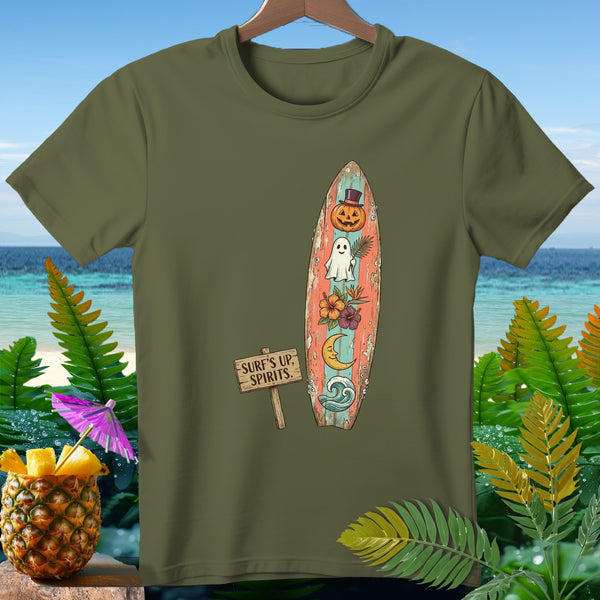 Green t-shirt with surfboard graphic featuring pumpkin, ghost, moon, and waves. Text reads "SURF'S UP, SPIRITS."