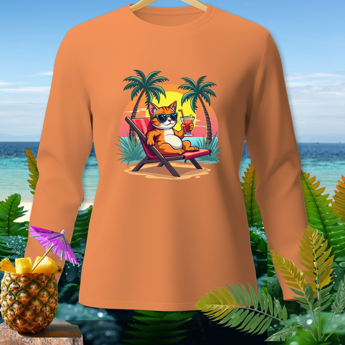 Orange long-sleeve shirt with cartoon cat in a lounge chair on a beach.