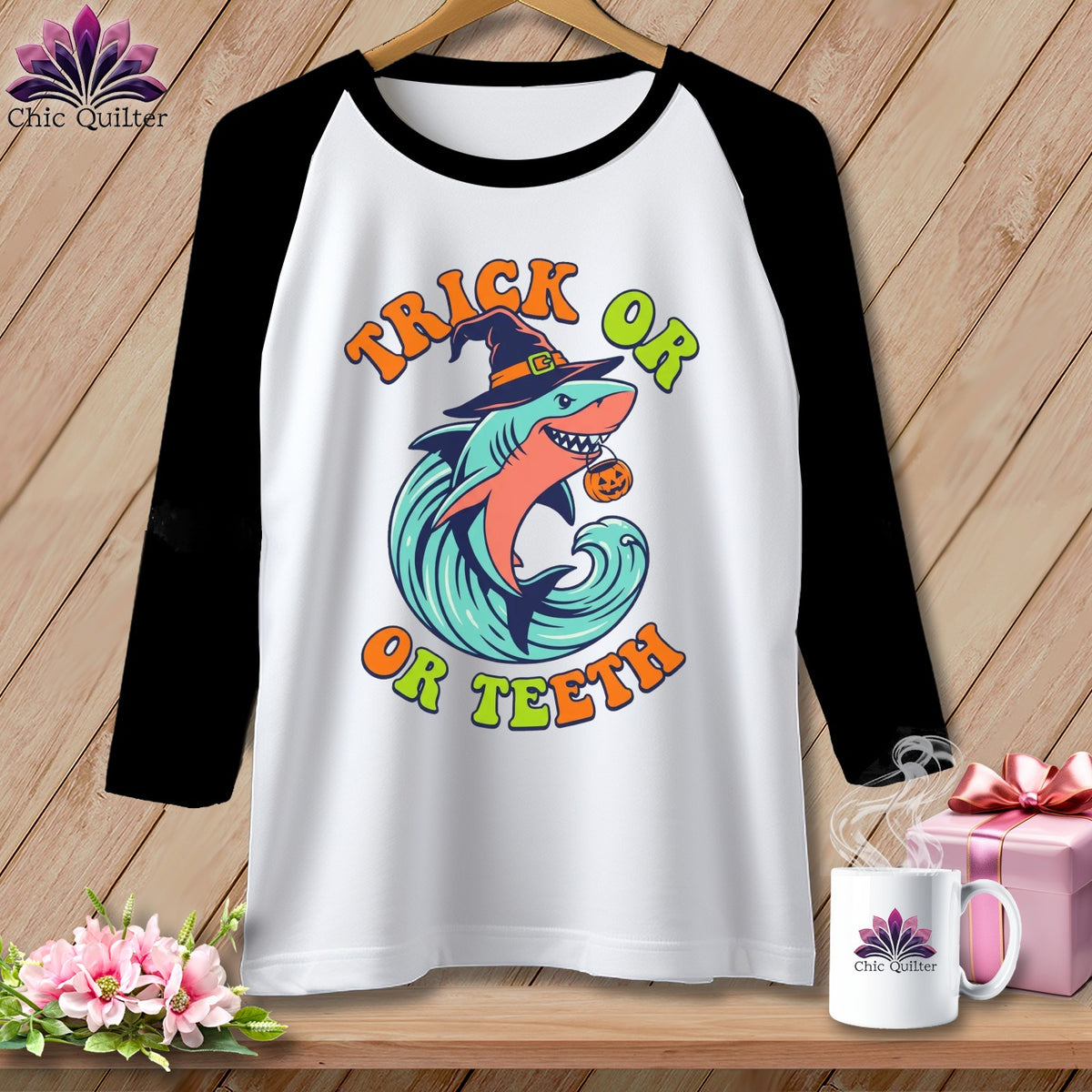 Raglan t-shirt with shark wearing witch hat and "Trick Or Teeth" Halloween text.