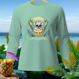 Mint green long-sleeve shirt with a koala relaxing in a hammock.