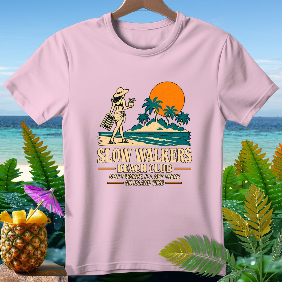 Pink t-shirt with "Slow Walkers Beach Club" text and island graphic.