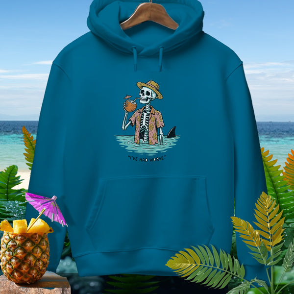 Teal hoodie with skeleton drinking cocktail in water and shark fin.