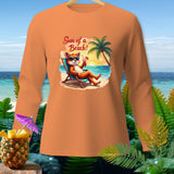 Orange long-sleeve shirt with graphic of fox relaxing on beach with text 