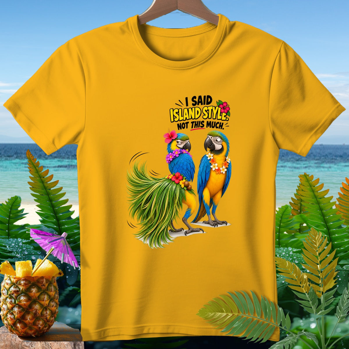 Yellow t-shirt with two macaws and text "I SAID ISLAND STYLE. NOT THIS MUCH."