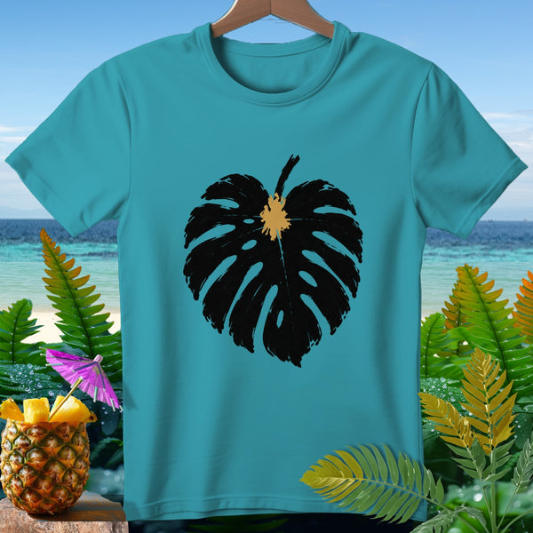 Teal t-shirt with black monstera leaf print, tropical background.