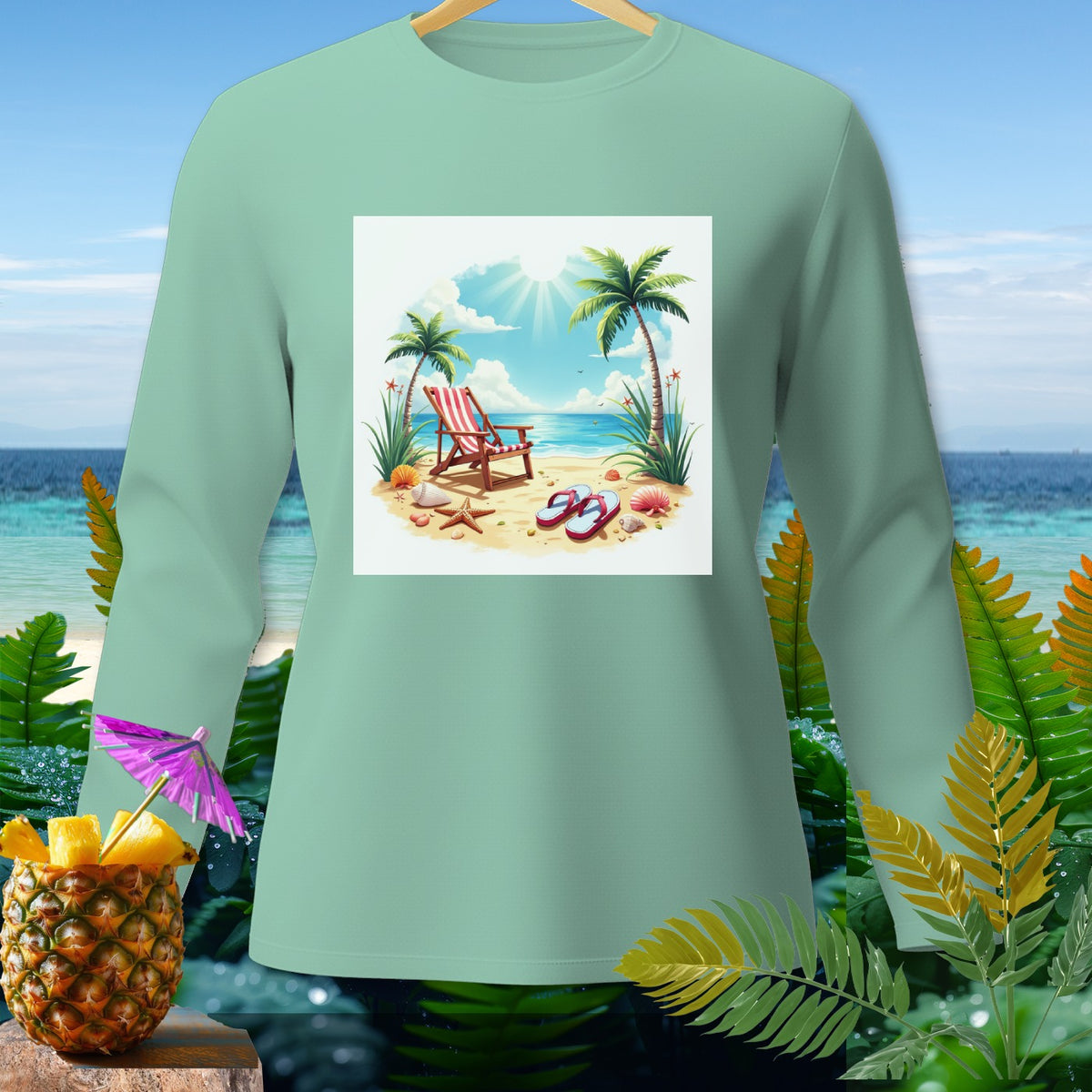 Light teal long-sleeve shirt with a beach scene graphic and a pineapple drink.
