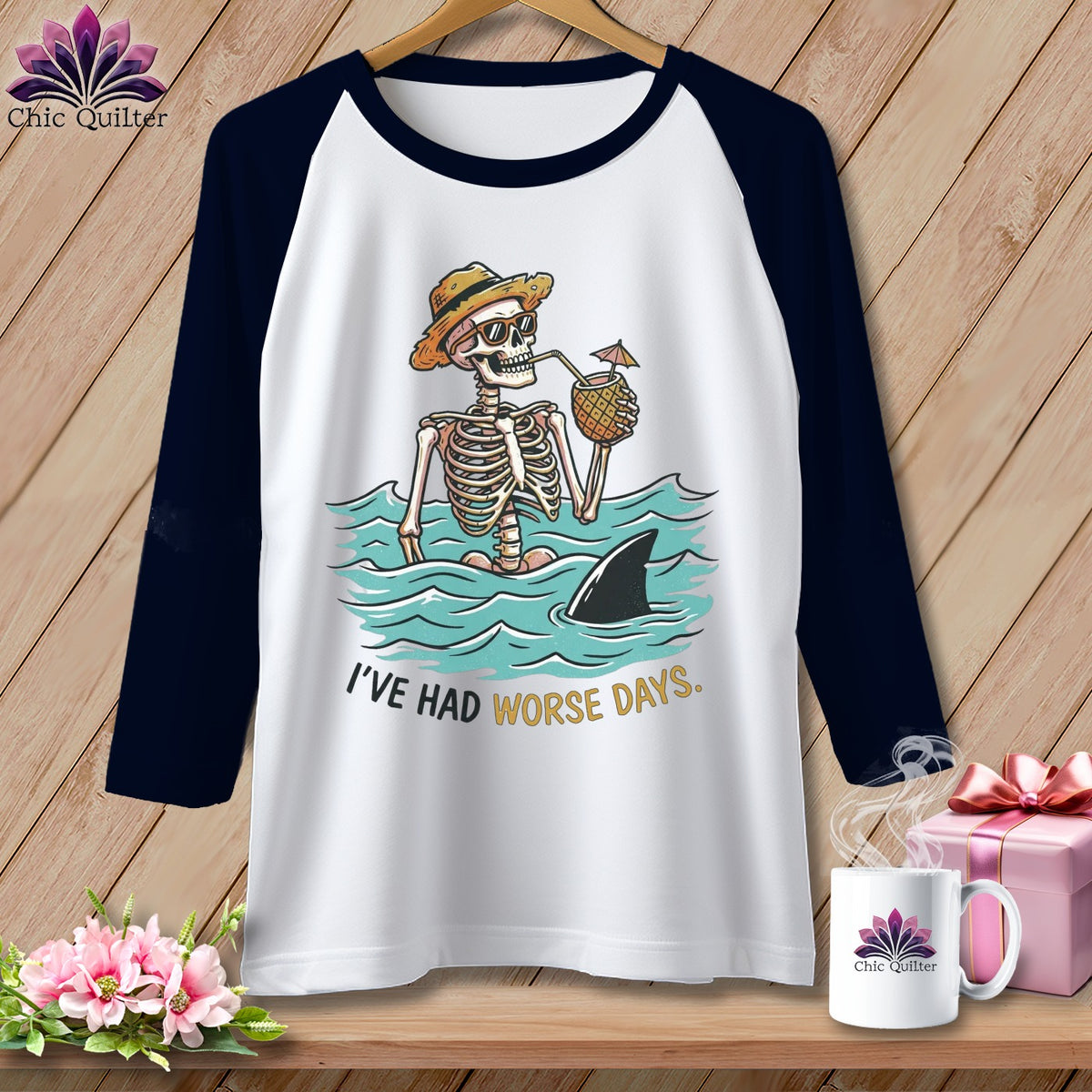 Baseball raglan t-shirt with skeleton in water, shark fin, and text "I'VE HAD WORSE DAYS."