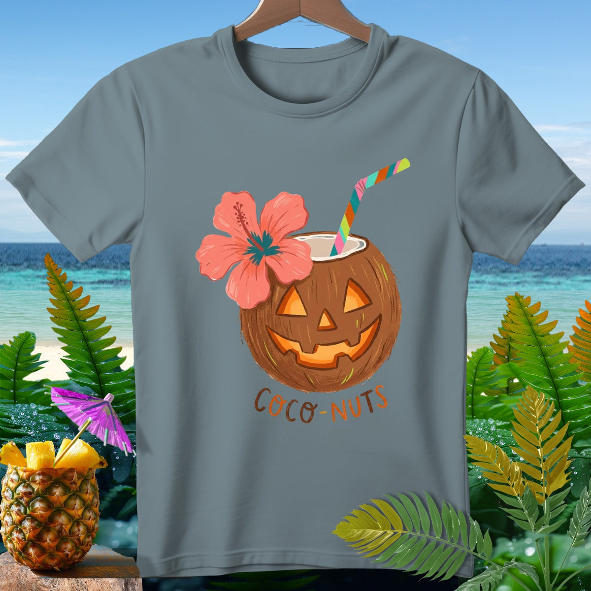 Gray t-shirt with a jack-o-lantern coconut drink with flower and straw.