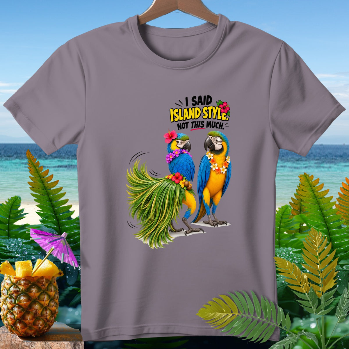 Two macaws on a t-shirt with text "I said island style, not this much."