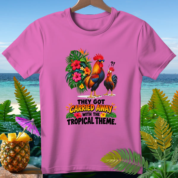 Pink t-shirt with roosters, tropical flowers, and text "They got carried away with the tropical theme."