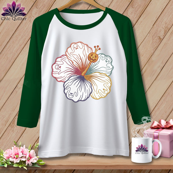 White baseball tee with colorful hibiscus, ghosts, and a jack-o-lantern.