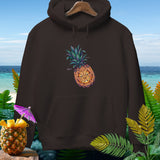 Brown hoodie with a Halloween pineapple graphic and a beach background.
