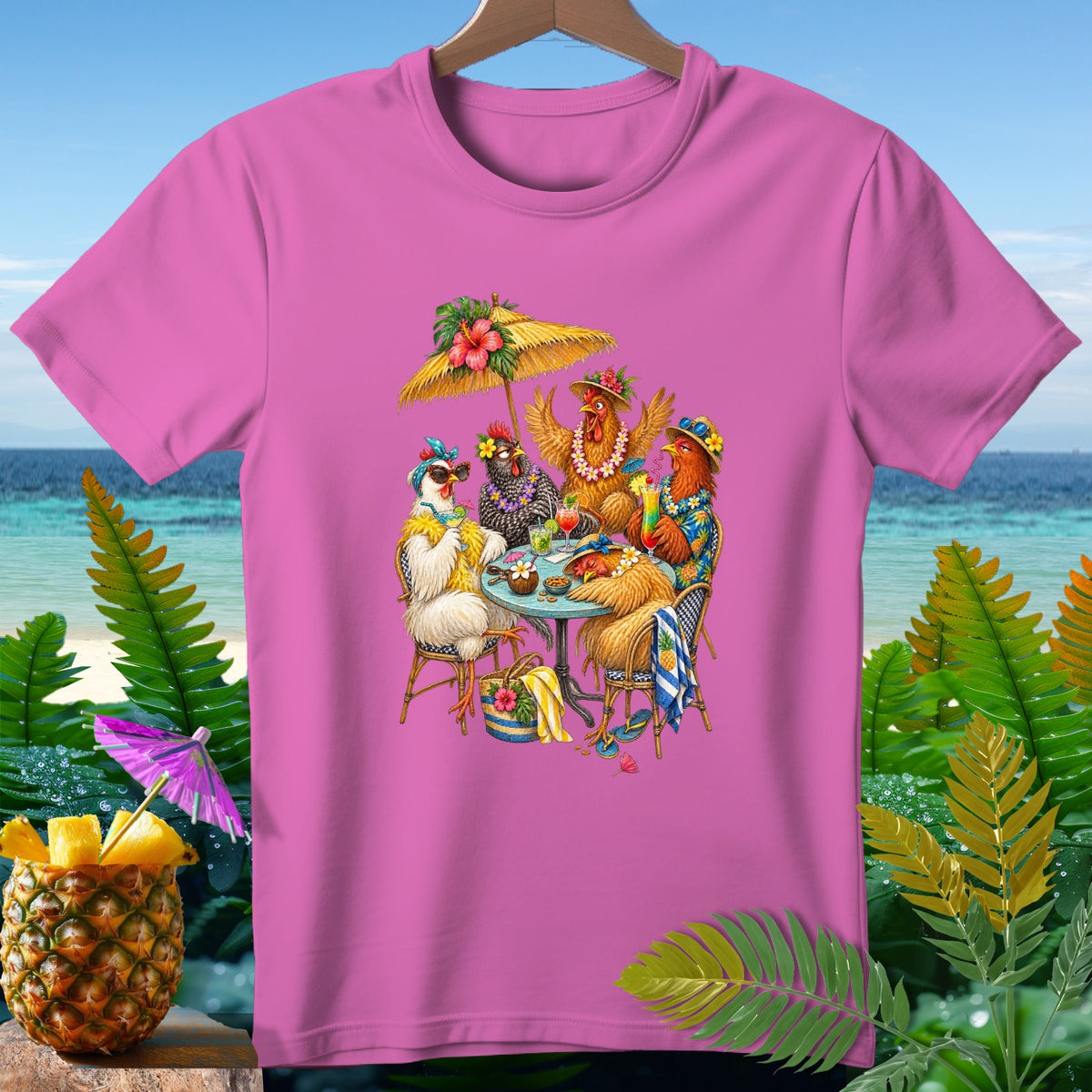 Four chickens in Hawaiian attire sit at a table under a tiki umbrella by the ocean.