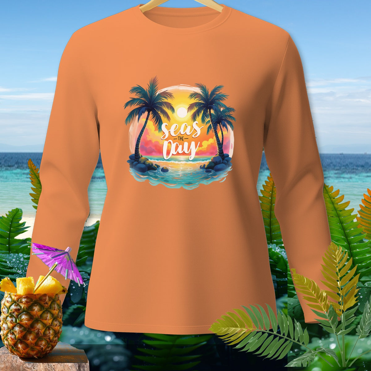 Orange long-sleeve shirt with a beach sunset graphic that reads "seas the Day".