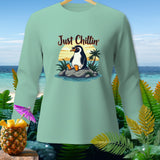 Mint green long-sleeve shirt with a penguin graphic and 