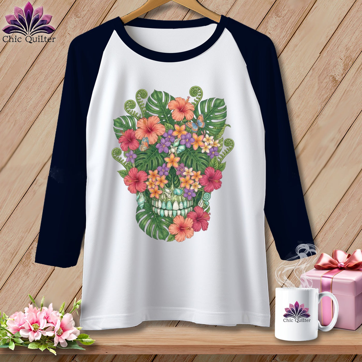White raglan sleeve t-shirt with a floral skull graphic and a "Chic Quilter" logo.