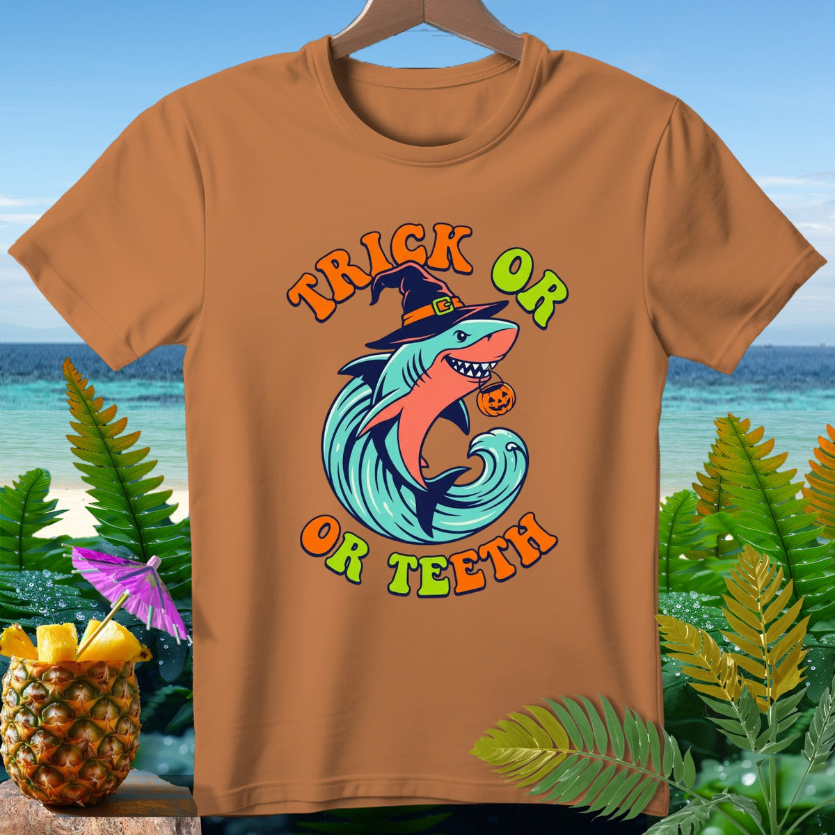 Orange t-shirt with a Halloween shark design and text "Trick Or Or Teeth".