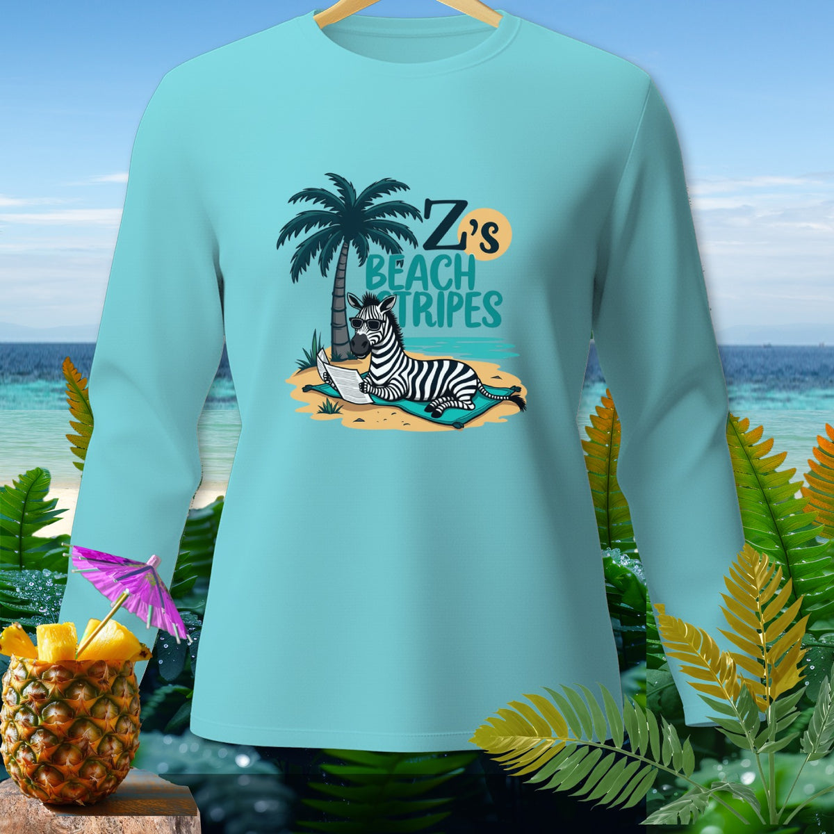 Long-sleeve shirt with zebra reading on beach, text "Z's Beach Tripes".