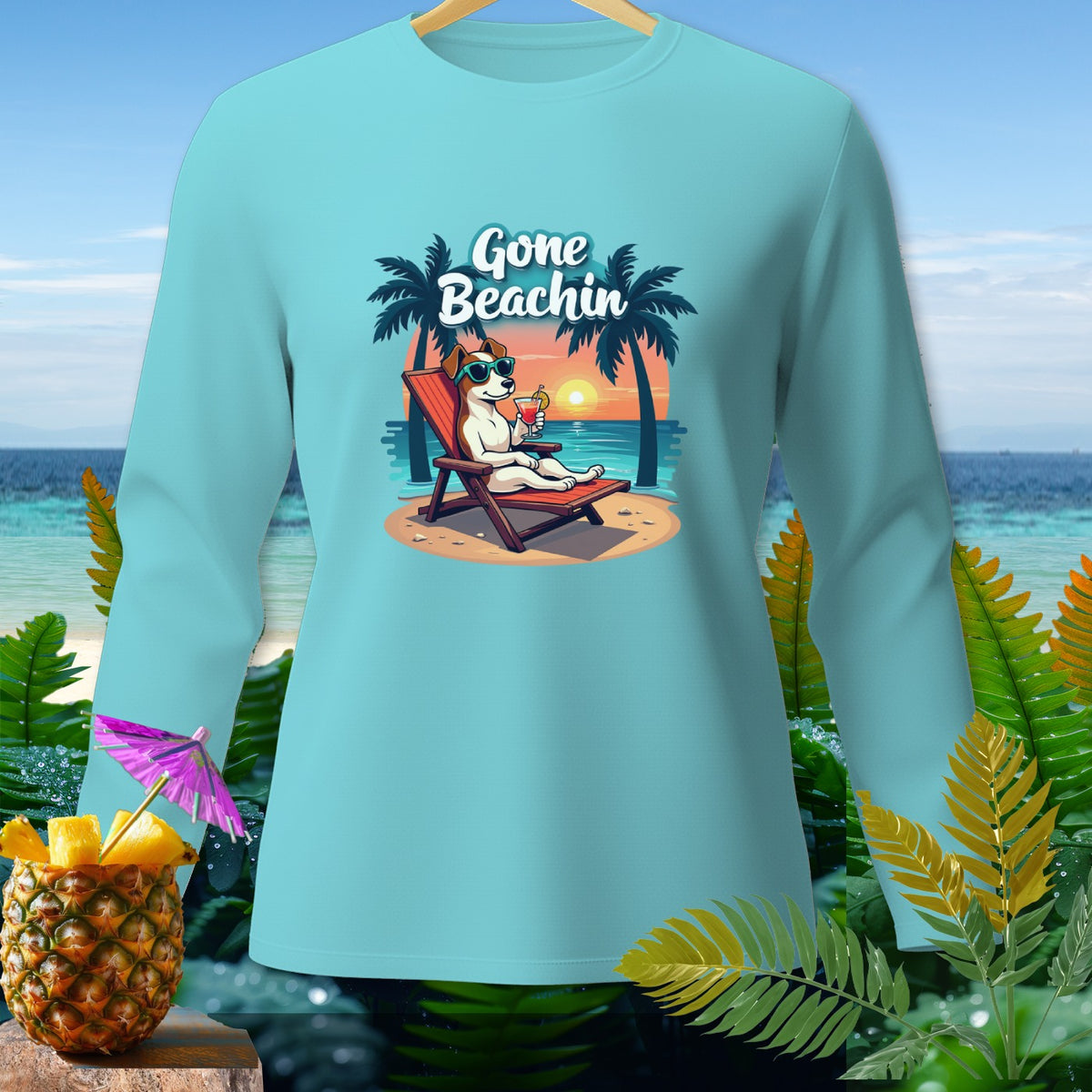 Light blue long-sleeve shirt with cartoon dog on beach chair, "Gone Beachin'" text.