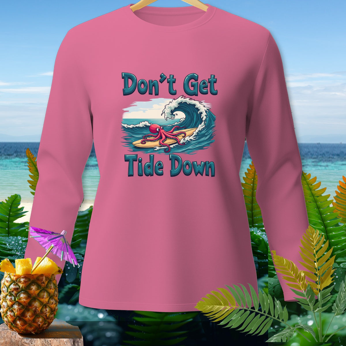 Pink long-sleeve shirt with an octopus surfing and text "Don't Get Tide Down".