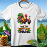 White t-shirt with roosters and tropical flowers, reading 