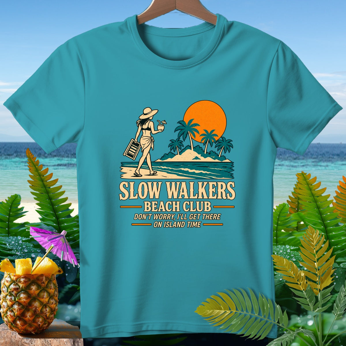 Teal t-shirt with "Slow Walkers Beach Club" graphic and beach scene.