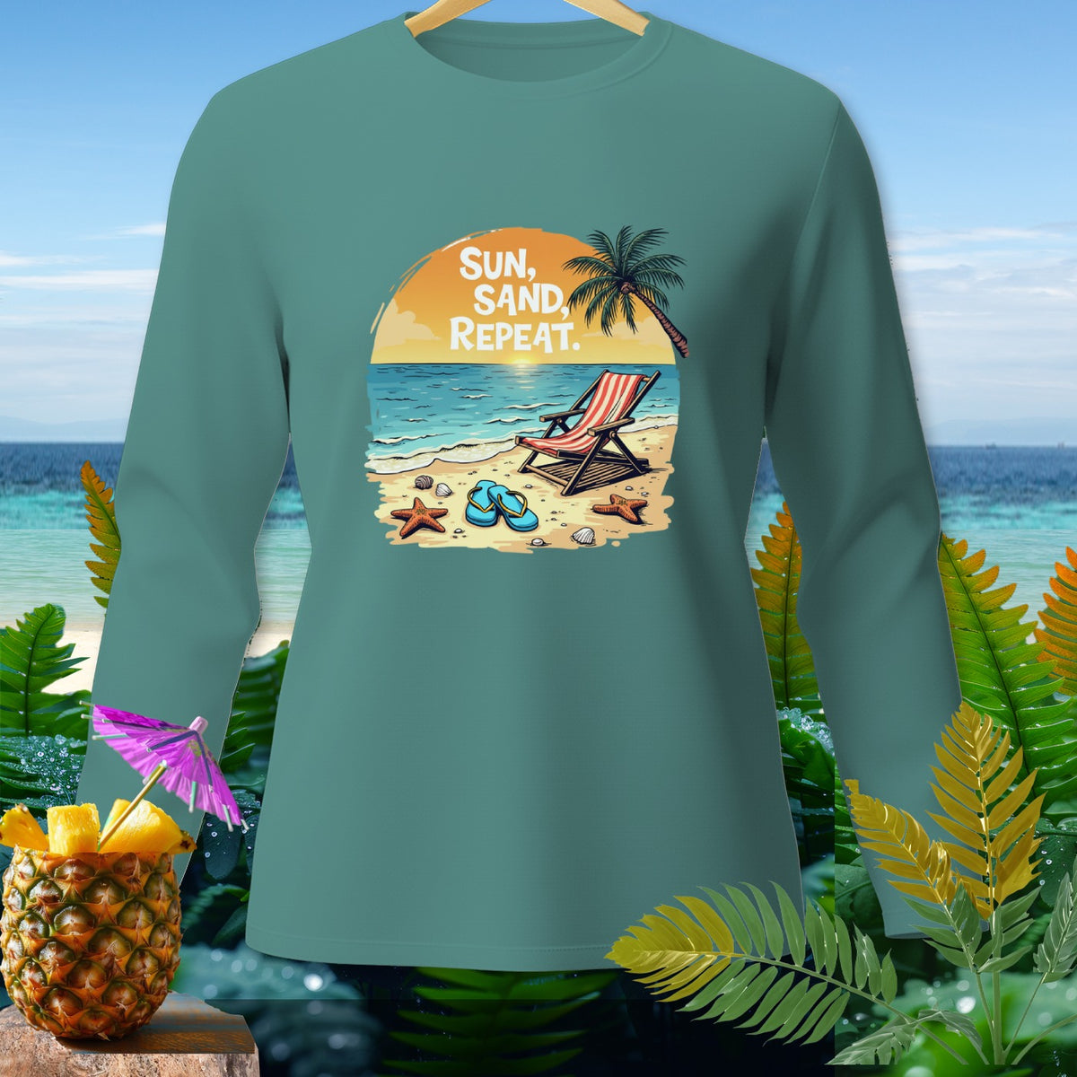 Teal long-sleeve shirt with "Sun, Sand, Repeat" beach scene graphic.