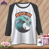 Baseball tee with a wave graphic featuring ghosts and a surfer, and 