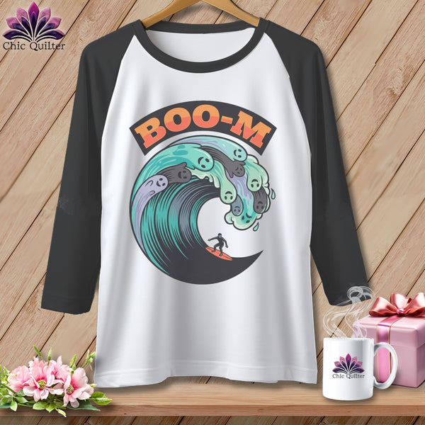 Baseball tee with a wave graphic featuring ghosts and a surfer, and "BOO-M" text.