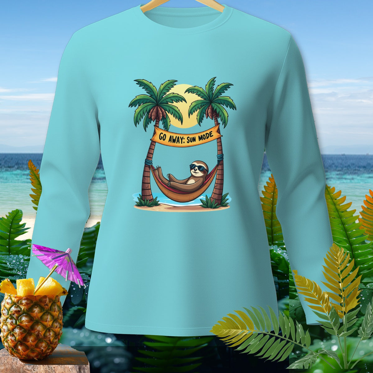 Light blue long-sleeve shirt with a sloth in a hammock on a beach banner.