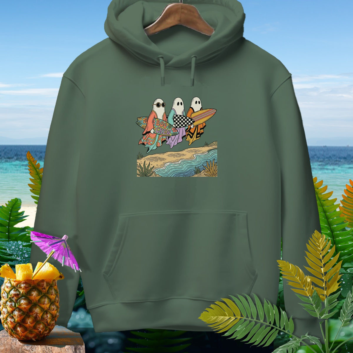Green hoodie with a graphic of ghosts on surfboards saying "Boo Crew".