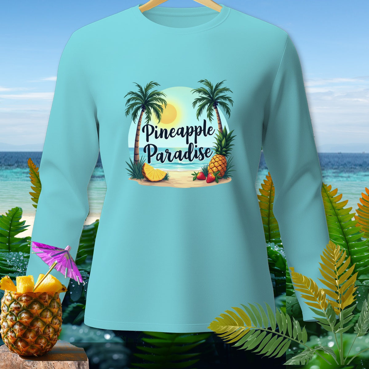 Light blue long-sleeve shirt with "Pineapple Paradise" text and beach graphic.