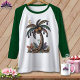 White raglan shirt with Halloween palm tree graphic, bats, pumpkins, ghost, and moon.